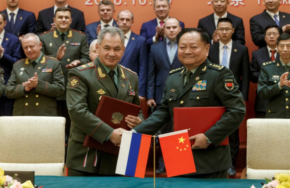 Russian and Chinese military officials at a meeting